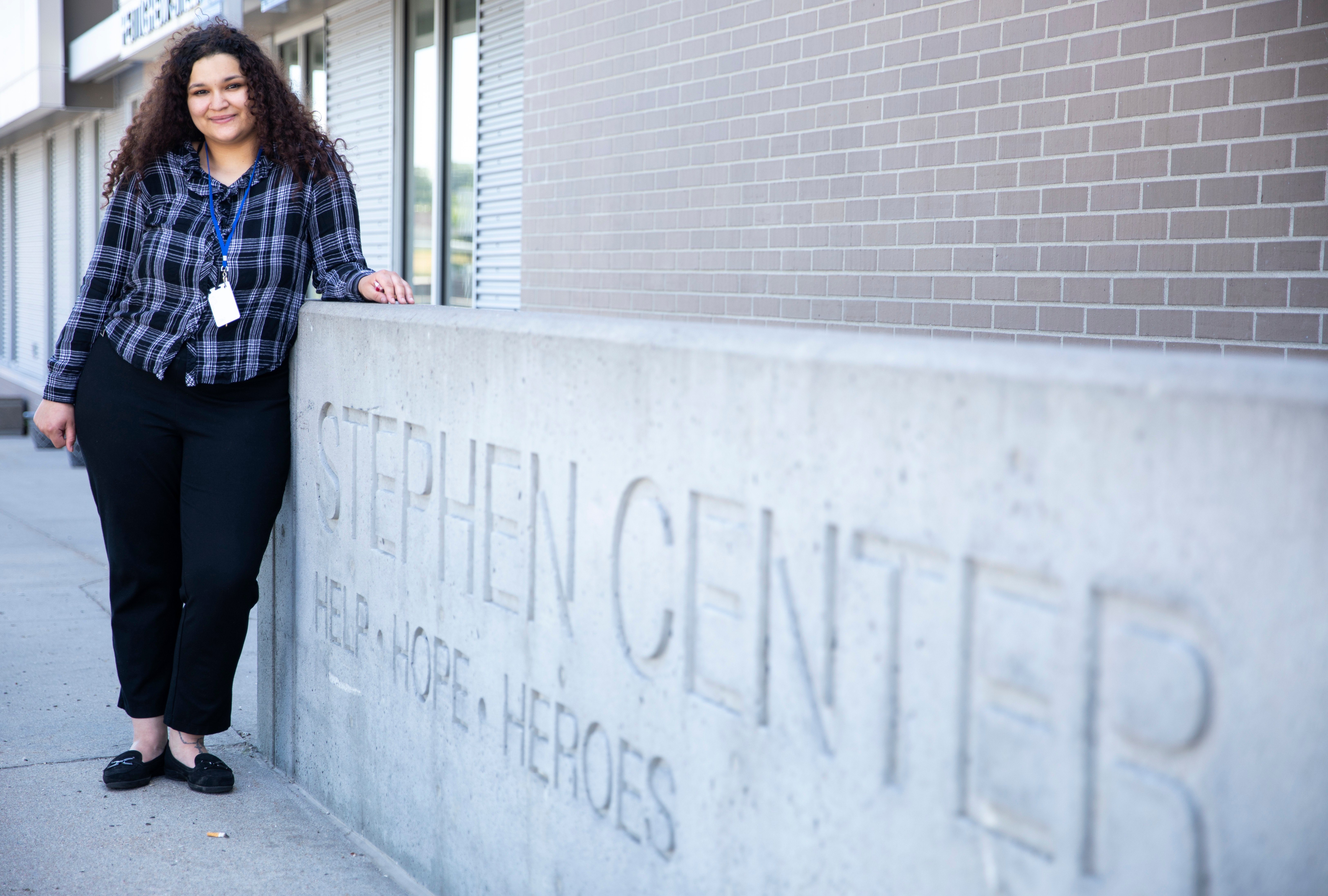 Photo of Mariyah Jackson in front of the Steven Center sign.
