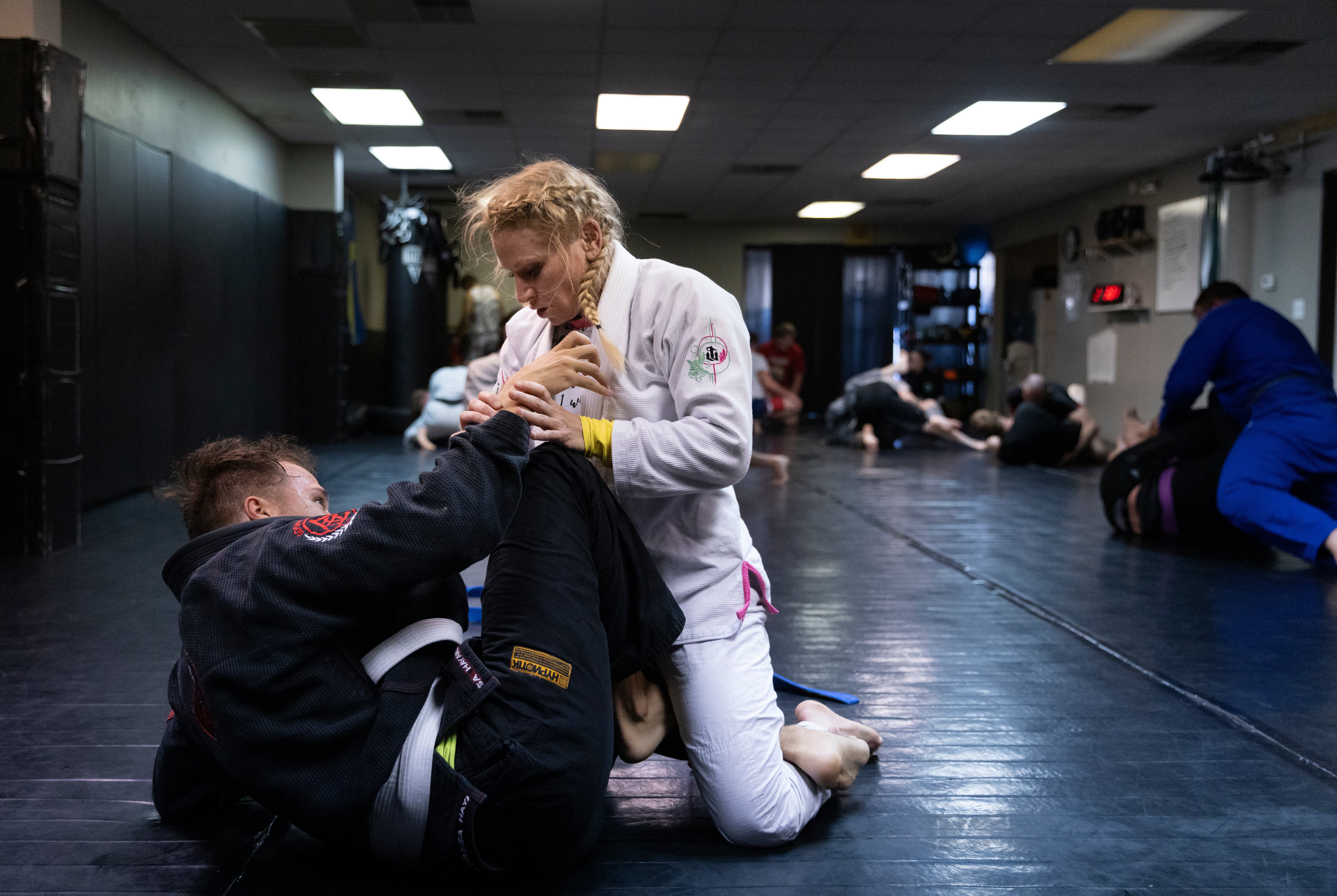 Photo of Brianne Ramirez teaching a jiu jitsu class.