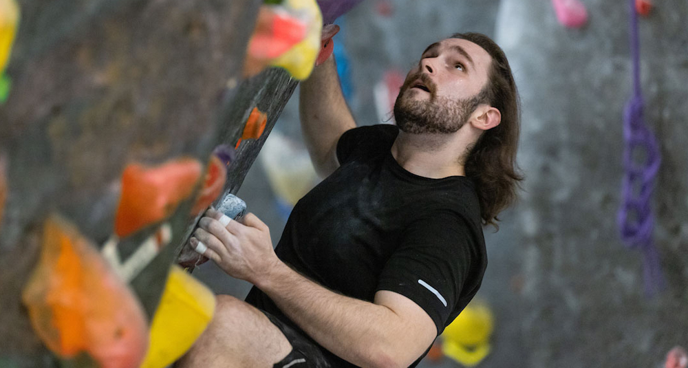 Joseph Wiese climbing indoor rock wall